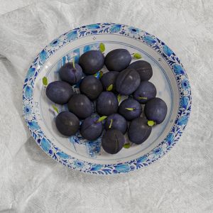 Still-life. Fruit on a platter (Blue plums)